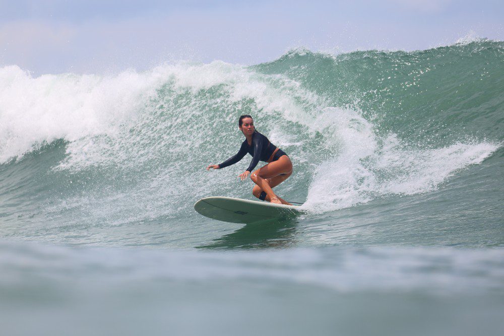 picture of a surfer on the emerald coast of Nicaragua surfing with Rancho Santana surf teachers