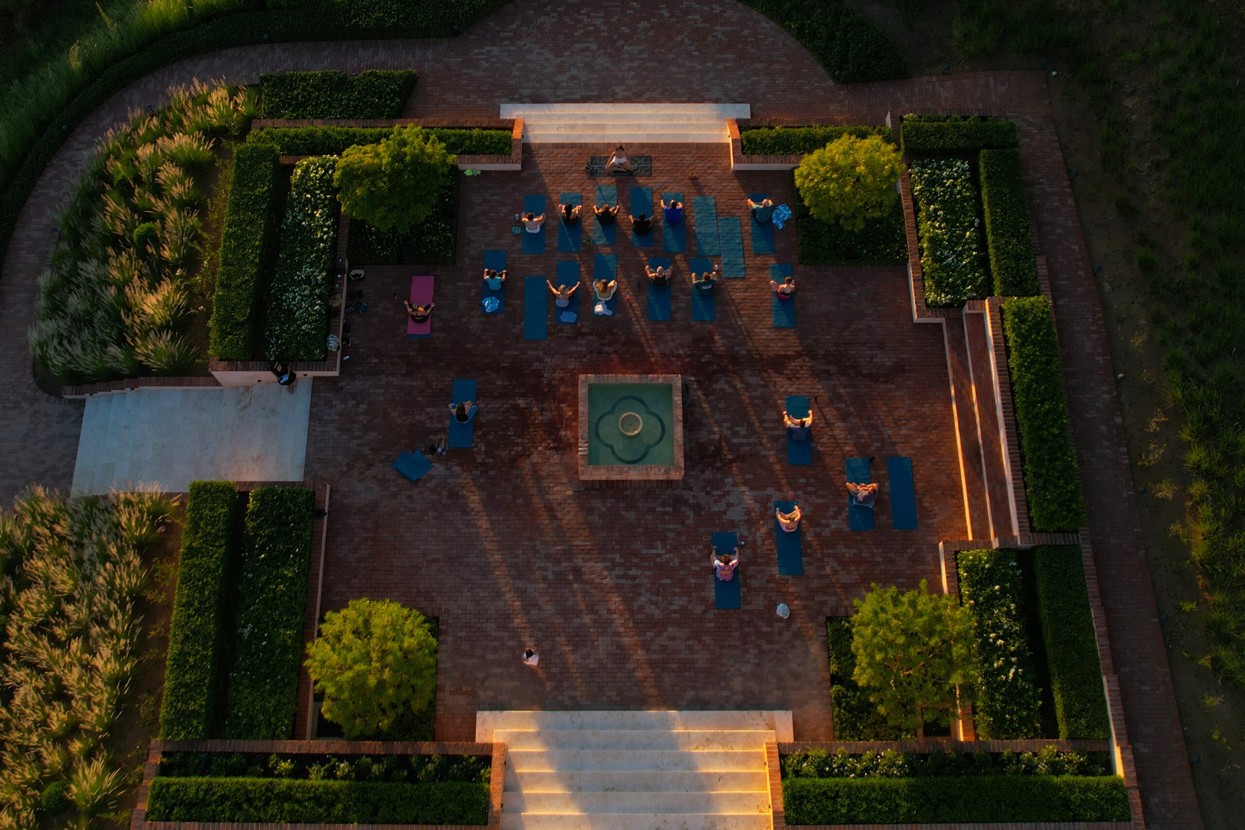 view of guests doing yoga at sunset at Rancho Santana